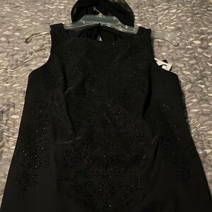 Perfect dress for a holiday party! Sleeveless with sequence details, size 8P.
